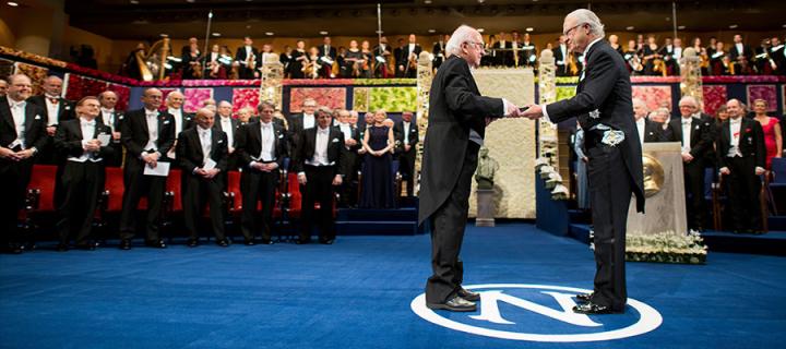 Photo of Professor Higgs receiving Nobel Prize