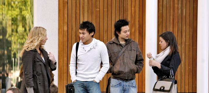 Group of international students chatting outside