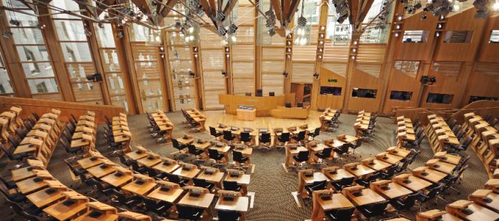 Wide angle view of the debating chamber of the Scottish Parliament, Edinburgh, Scotland, UK. Circular seating.
