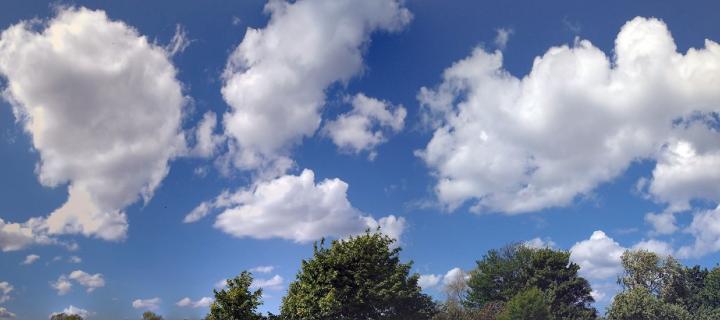 A photo of white clouds against a blue sky