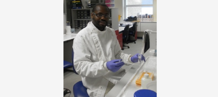 Dennis Muhanguzi doing lab work