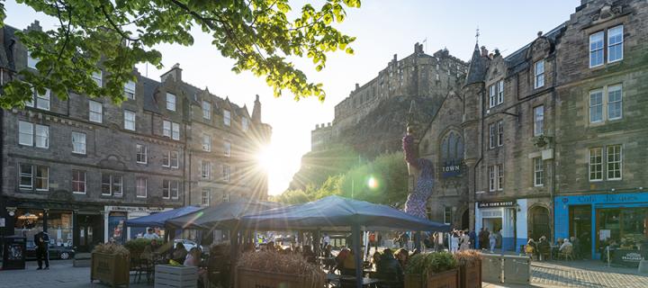 Panorama of Grassmarket square with Edinburgh castle in the background