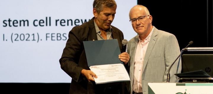 Image of Professor Ian Chambers receiving an award 