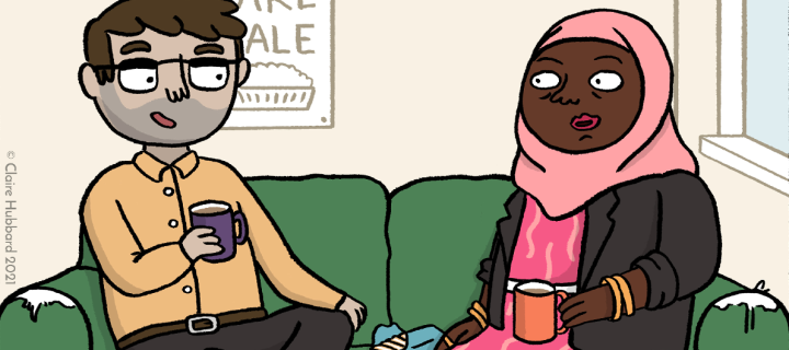 man and woman drinking coffee and having a conversation while sitting on a sofa