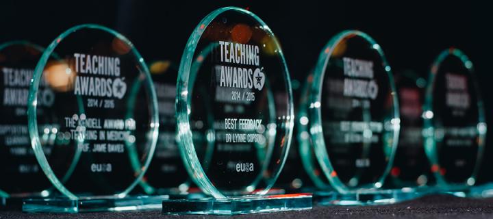 The Teaching Awards with recipients' names engraved on them.