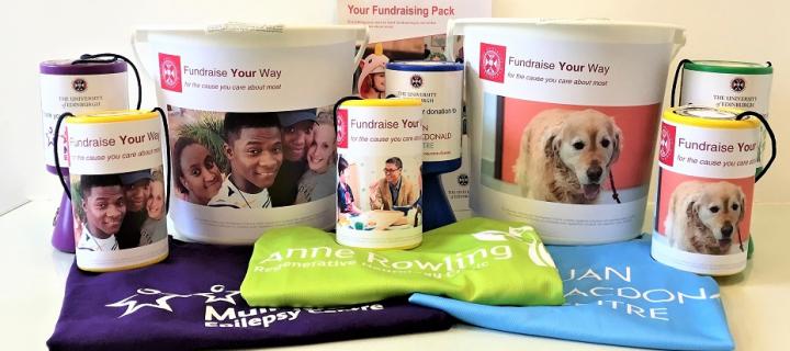 A selection of fundraising resources including branded t-shirts, collection buckets and tins.