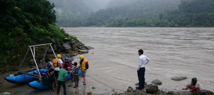 Researchers preparing a raft for river sampling in Nepal