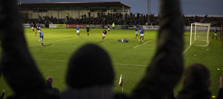  Home supporters celebrating Michael McKenna's equaliser as Arbroath play Queen of the South