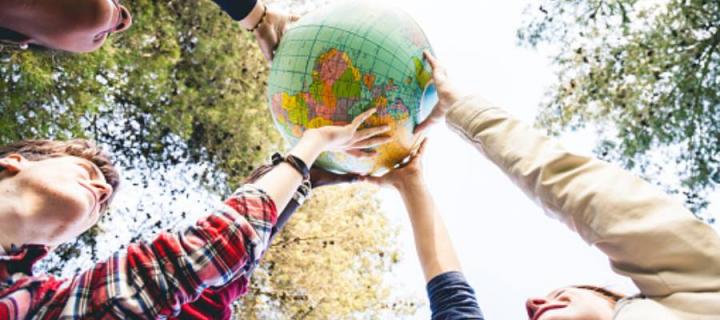 Hands holding a globe