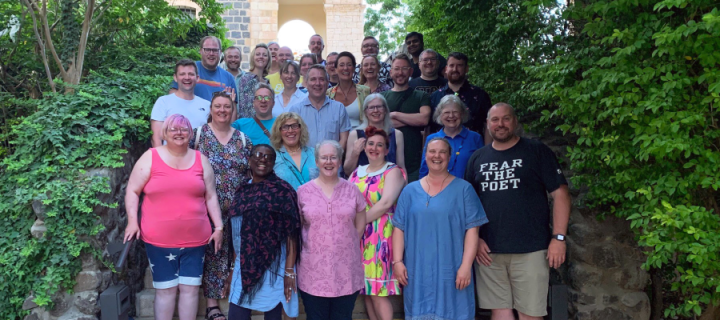 Colour photo of Church of Scotland Ministry candidates with New College staff, standing on stairs during a trip to the Holy Land