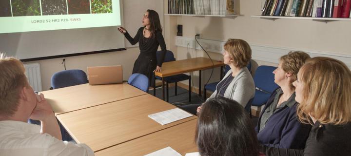 Woman giving powerpoint presentation