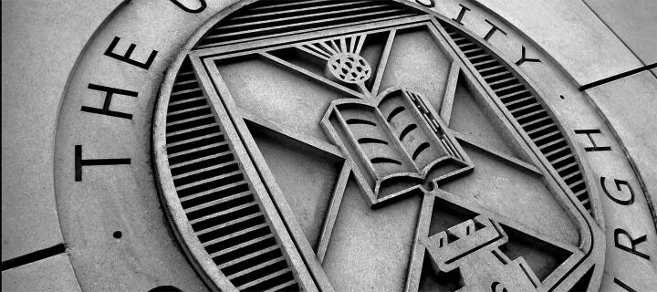 A close up of the university crest