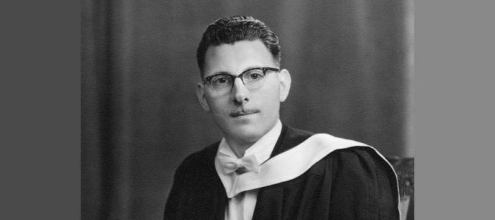 Ian Malcolm in his graduation robes in 1960 (black and white)