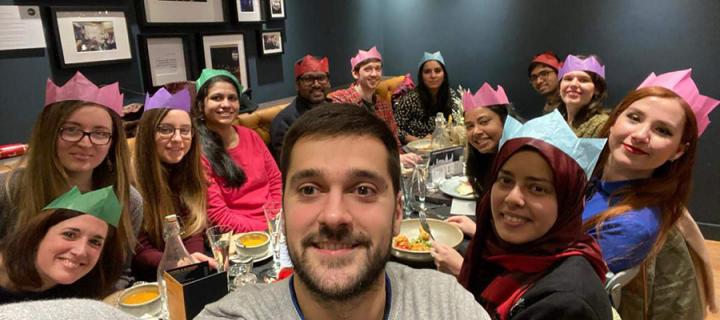 Group photo of lab members at a Christmas meal