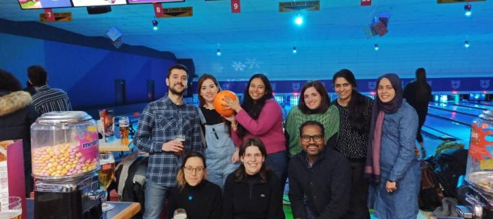 Group photo of lab group members at a bowling alley