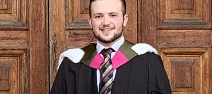 Man in graduation robes