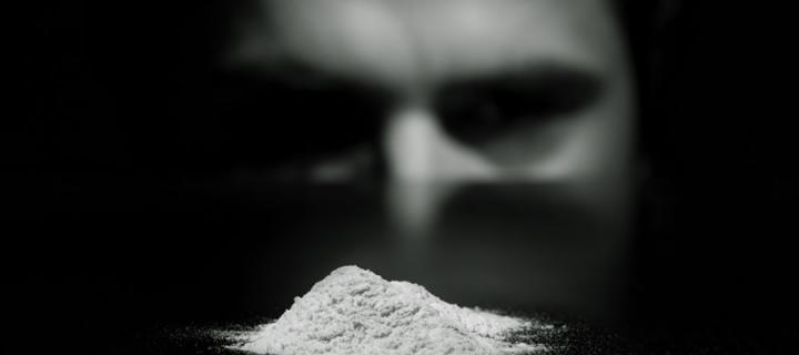 Man looking at cocaine