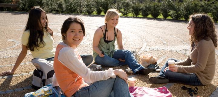 International students relaxing in the George Square labyrinth
