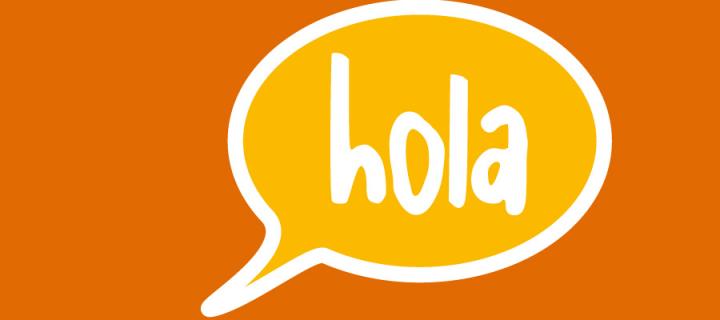 'hola' in speech bubble
