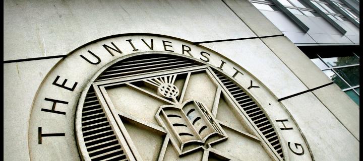 Image of University logo on building wall 