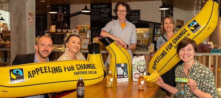 Fairtrade University Awards photoshoot Levels Cafe summer 2022. Inflatable bananas read: "appeeling for change"