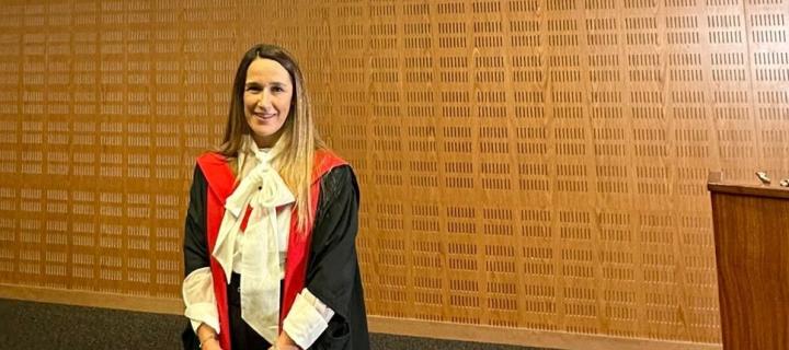 Professor Lisa Boden wears an academic robe on the occasion of her inaugural lecture 