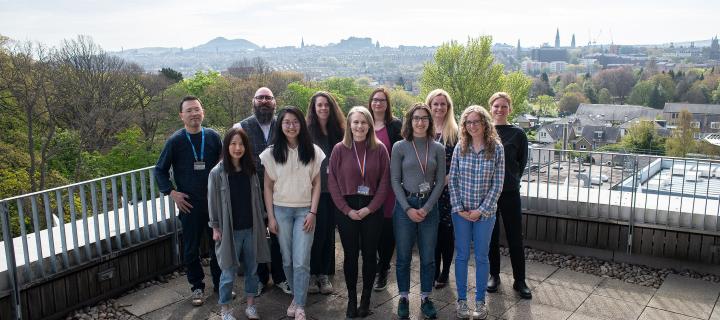 Liz Patton and her team on balcony overlooking Edinburgh