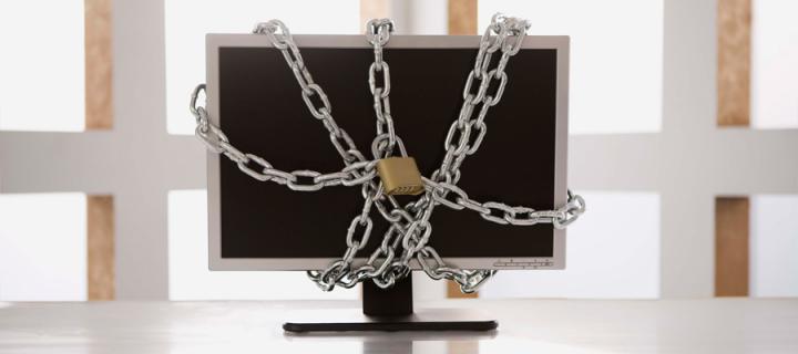 Computer screen locked in metal chain