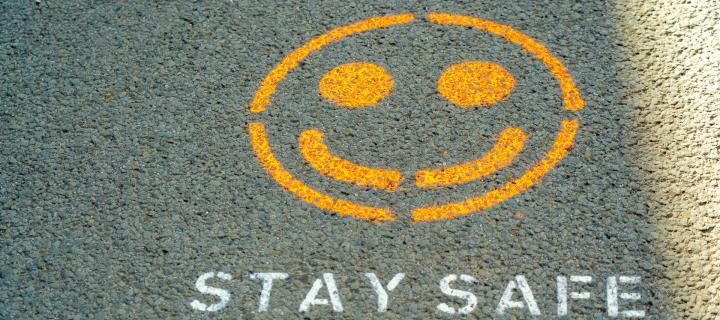 Smiley face above the words 'stay safe'