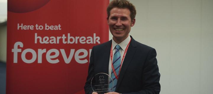 Professor Nicholas Mills with Research Fellow of the Year Award