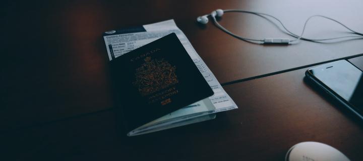 Passport and headphones on table