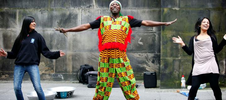 Image of three people doing outdoor drum performance