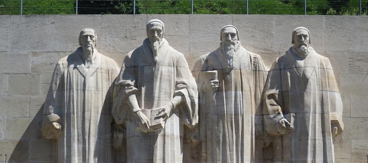 Reformation Wall in Geneva with statues of William Farel, John Calvin, Theodore Beza and John Knox.