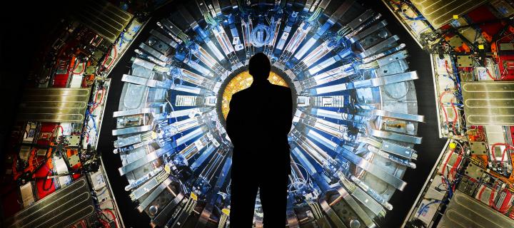 Silhouette of a man against the Large Hadron Collider, CERN, Switzerland
