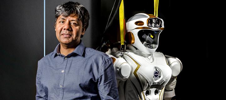 Professor Sethu Vijayakumar with the Valkyrie robot.