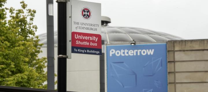 a photo of the university shuttle bus stop sign in front of potterrow