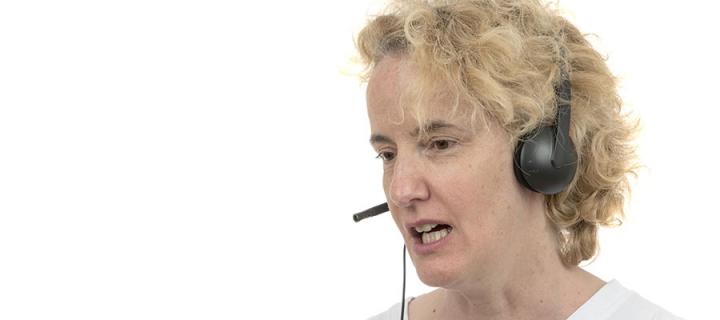 Woman wearing headphones giving support