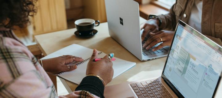 two women using surface devices for work or study