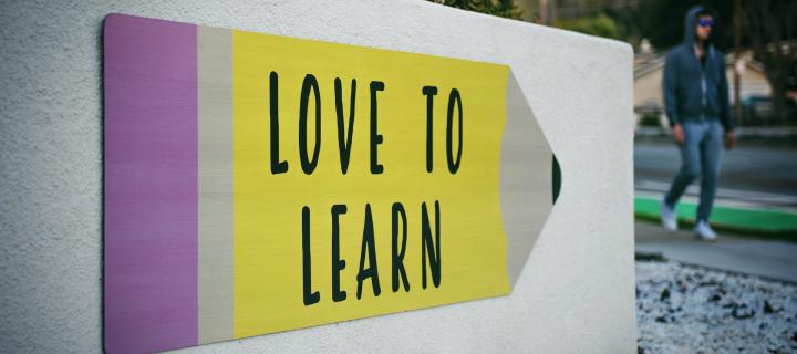 Sign saying "Love to Learn" outside a school