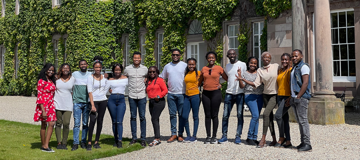 Group of African scholars outside country house