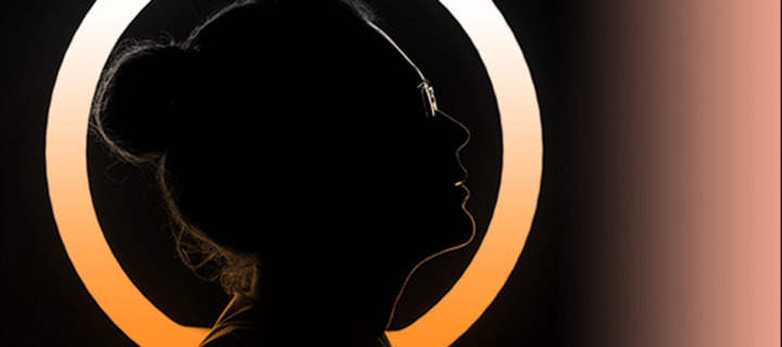 Silhouetted face with circle of light behind