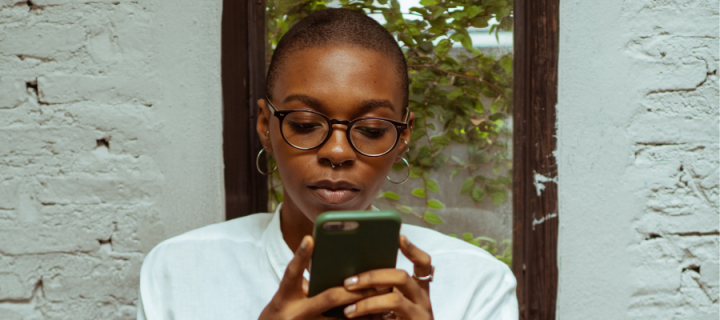 Image of a young woman looking at her phone