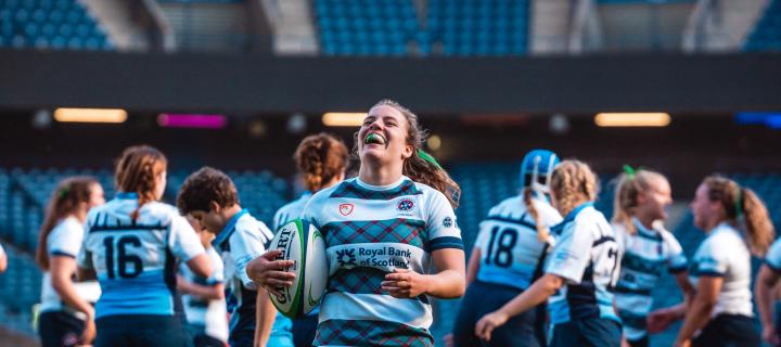 Women's Rugby Player smiling with ball at Murrayfield