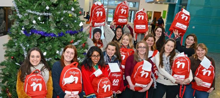 Vet students holding the bags collected for homeless people and their pets