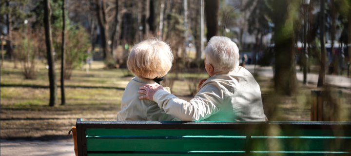 older people sitting on a bench