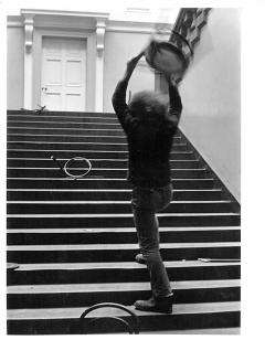 Stefan Wewerka’s ‘Bentwood Chair Action’ on the grand staircase with Klaus Rinke smashing chair (August 1970). Photo