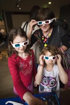 A family try on 3d glasses at the Edinburgh Science Festival