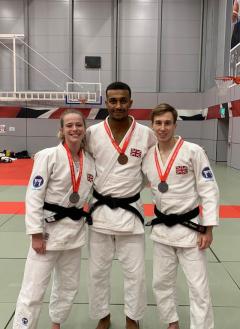 Image of Kirsty Marsh, Dylan Munro and Chris Kumesu-Egri with their medals from the Senior British Championships