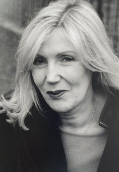 A black and white portrait of Lynda Myles