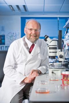 Professor Sir Ian Wilmut pictured in the Centre for Regenerative Medicine wearing a lab coat